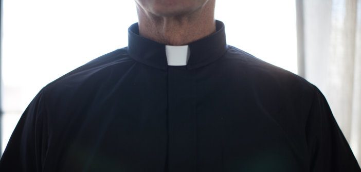 Closeup of a person wearing a clerical collar